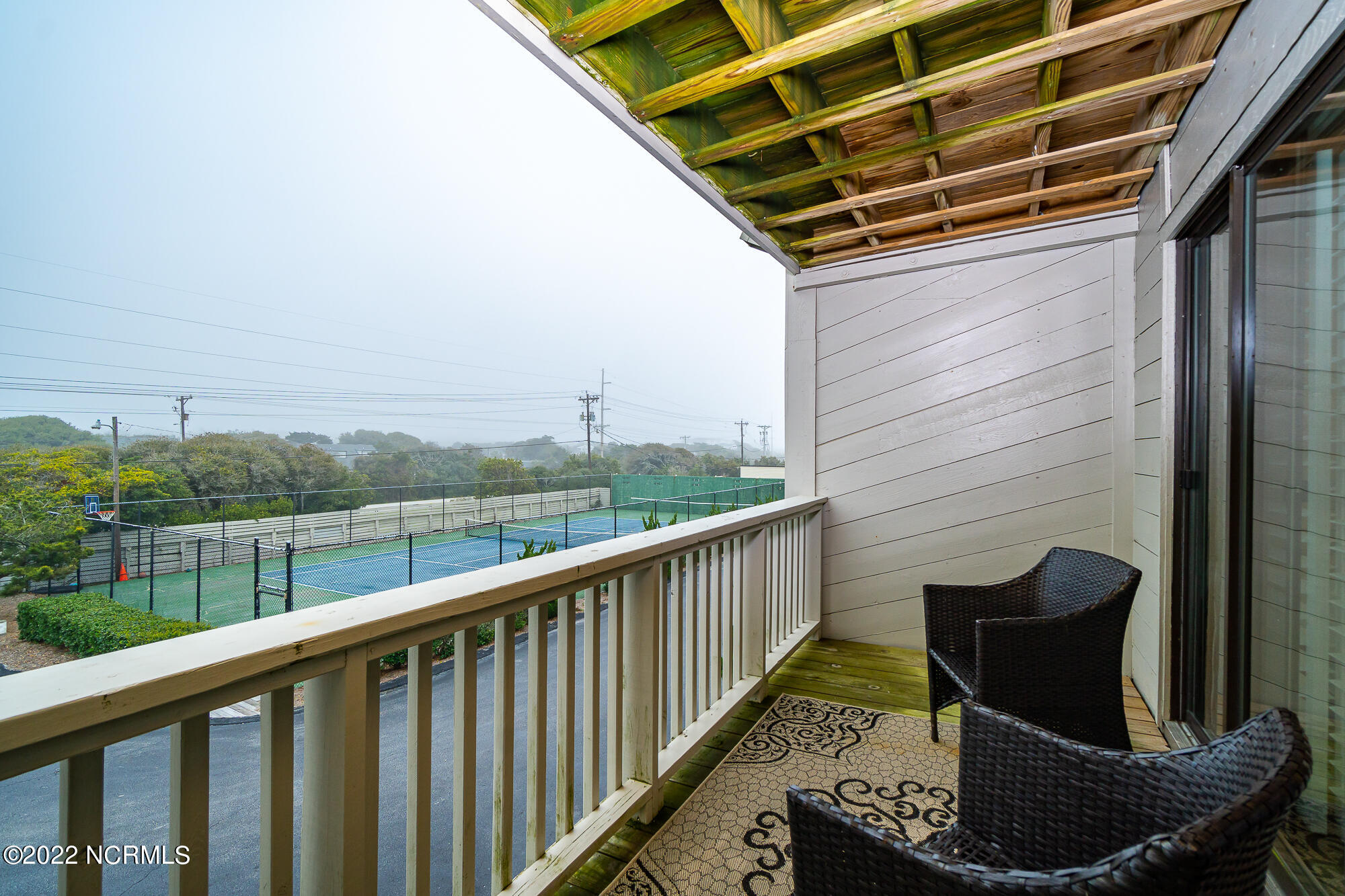 131 Salter Path Road, Unit 1 CORAL BAY WEST Atlantic Beach, NC 28512 - Photo 35 of 77 Private porch off guest room