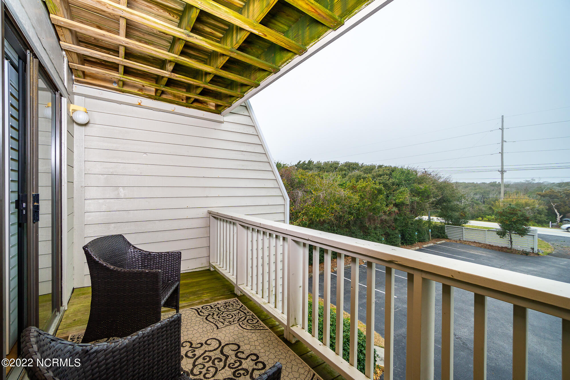 131 Salter Path Road, Unit 1 CORAL BAY WEST Atlantic Beach, NC 28512 - Photo 36 of 77 Private porch off guest room
