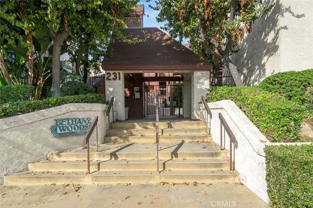 a view of a chair and tables on the patio