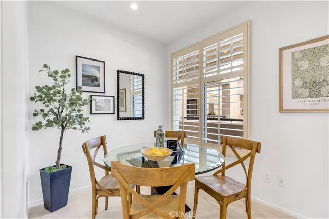 a bedroom with furniture and a potted plant