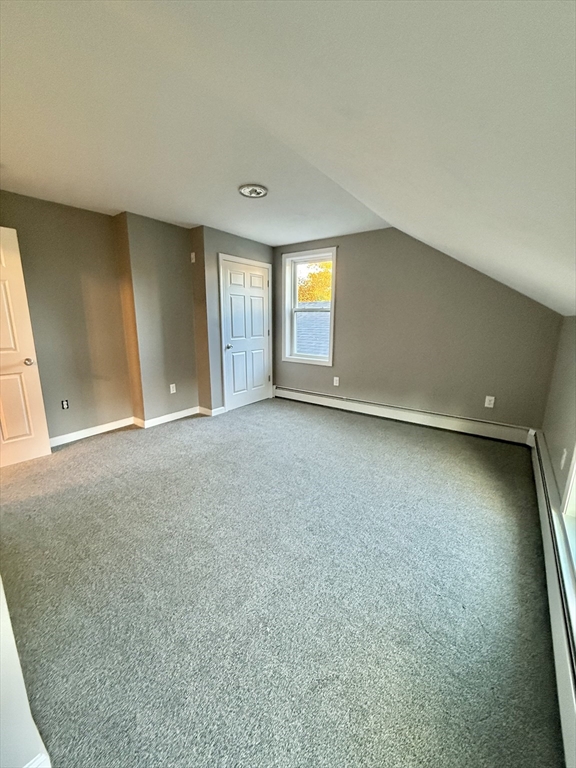 6 Canal Street, Unit B Sutton, MA 01590 - Photo 12 of 15 an empty room with a window and fireplace