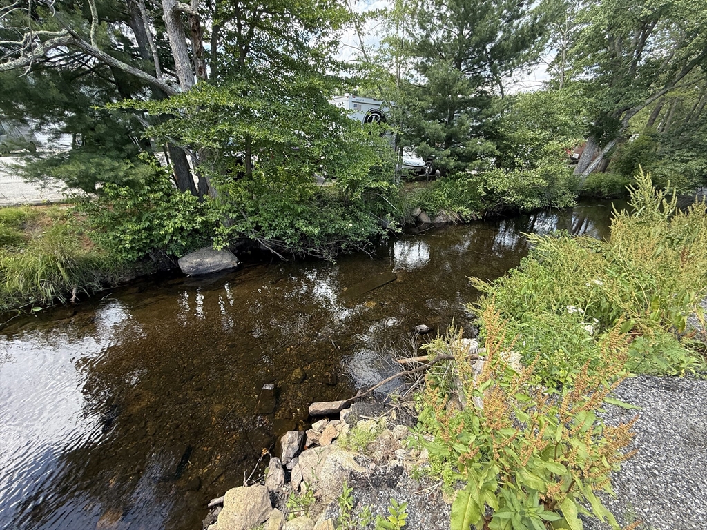 6 Canal Street, Unit B Sutton, MA 01590 - Photo 14 of 15 a view of lake with green space