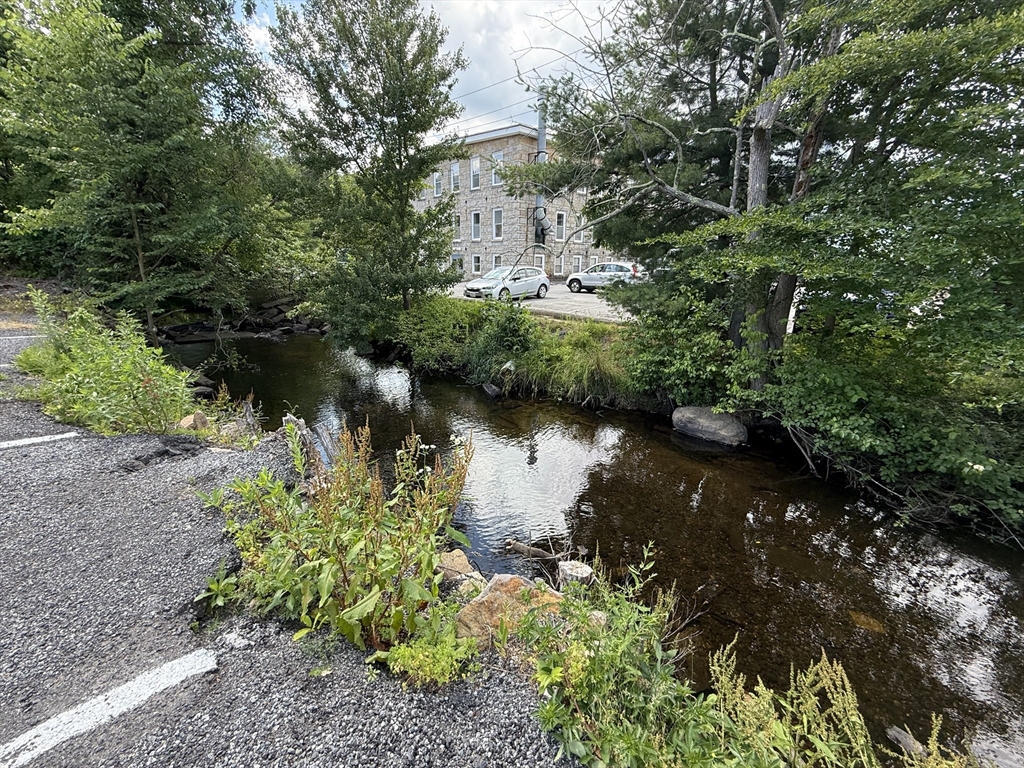 6 Canal Street, Unit B Sutton, MA 01590 - Photo 15 of 15 a view of a lake with a house