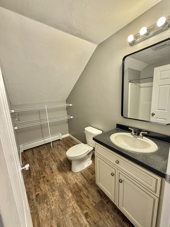 6 Canal Street, Unit B Sutton, MA 01590 - Photo 5 of 15 a spacious bathroom with a granite countertop sink and a mirror