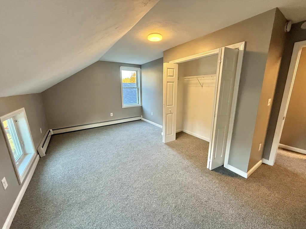 6 Canal Street, Unit B Sutton, MA 01590 - Photo 9 of 15 an empty room with windows