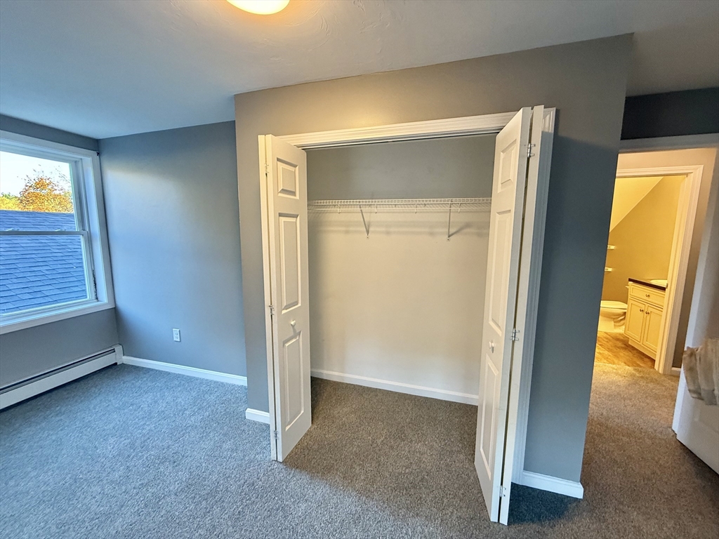 6 Canal Street, Unit B Sutton, MA 01590 - Photo 10 of 15 an empty room with windows