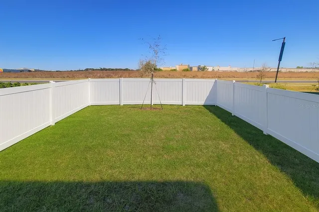 a view of a field with ocean view
