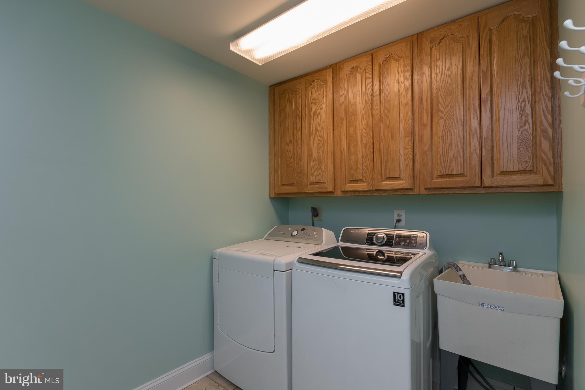 4921 Cove Road Fairfax, VA 22032 - Photo 16 of 30 Laundry/Mudroom with Built-In Cabinets