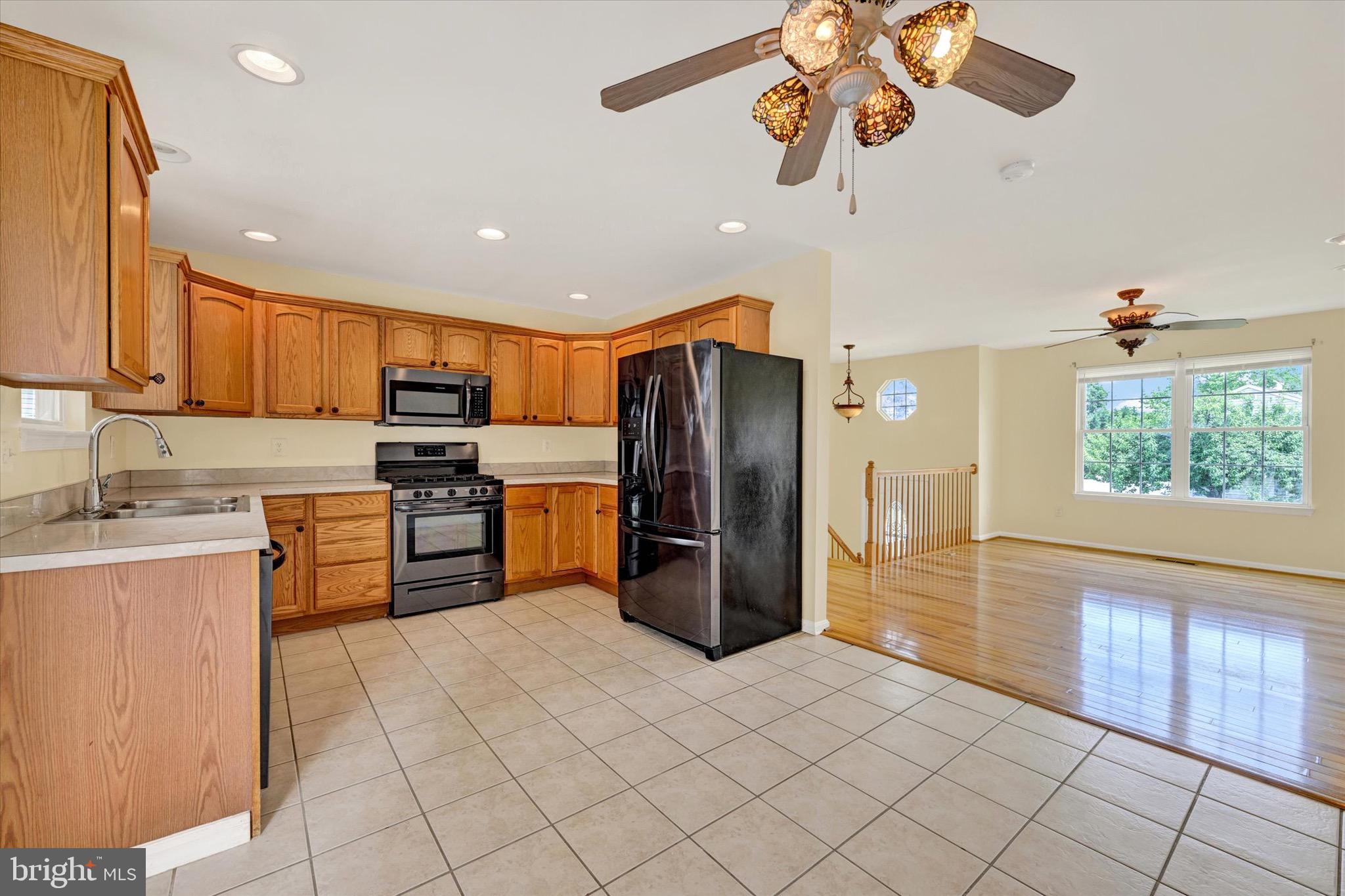 21 Box Circle Baltimore, MD 21221 - Photo 6 of 23 a kitchen with stainless steel appliances granite countertop a refrigerator a stove top oven a sink and dishwasher