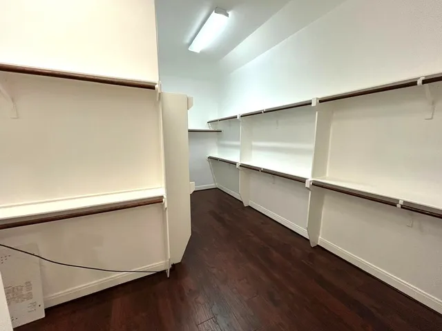 an empty room with wooden floor