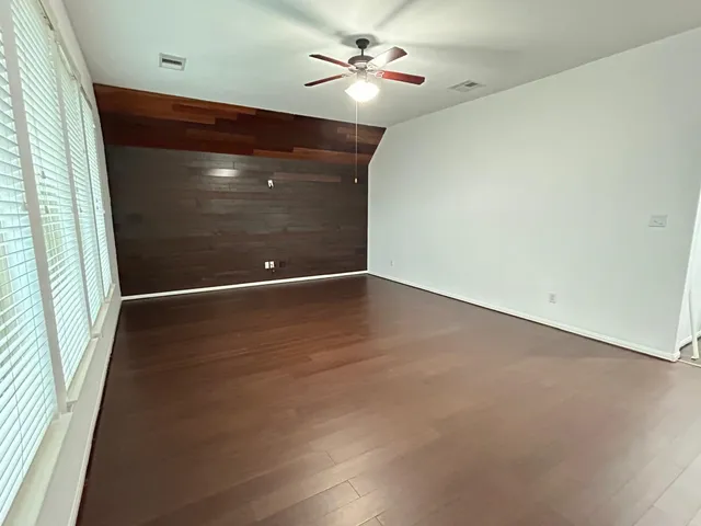 a bedroom with a bed and lamp