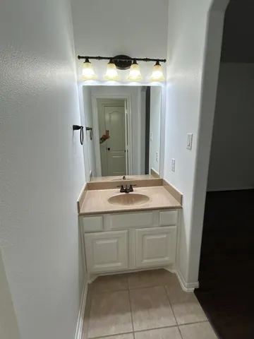a white toilet sitting next to a bath tub