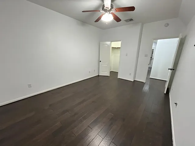 a bathroom with a sink and mirror with toilet