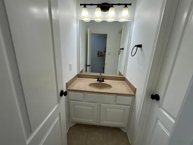 a white toilet sitting next to a bath tub