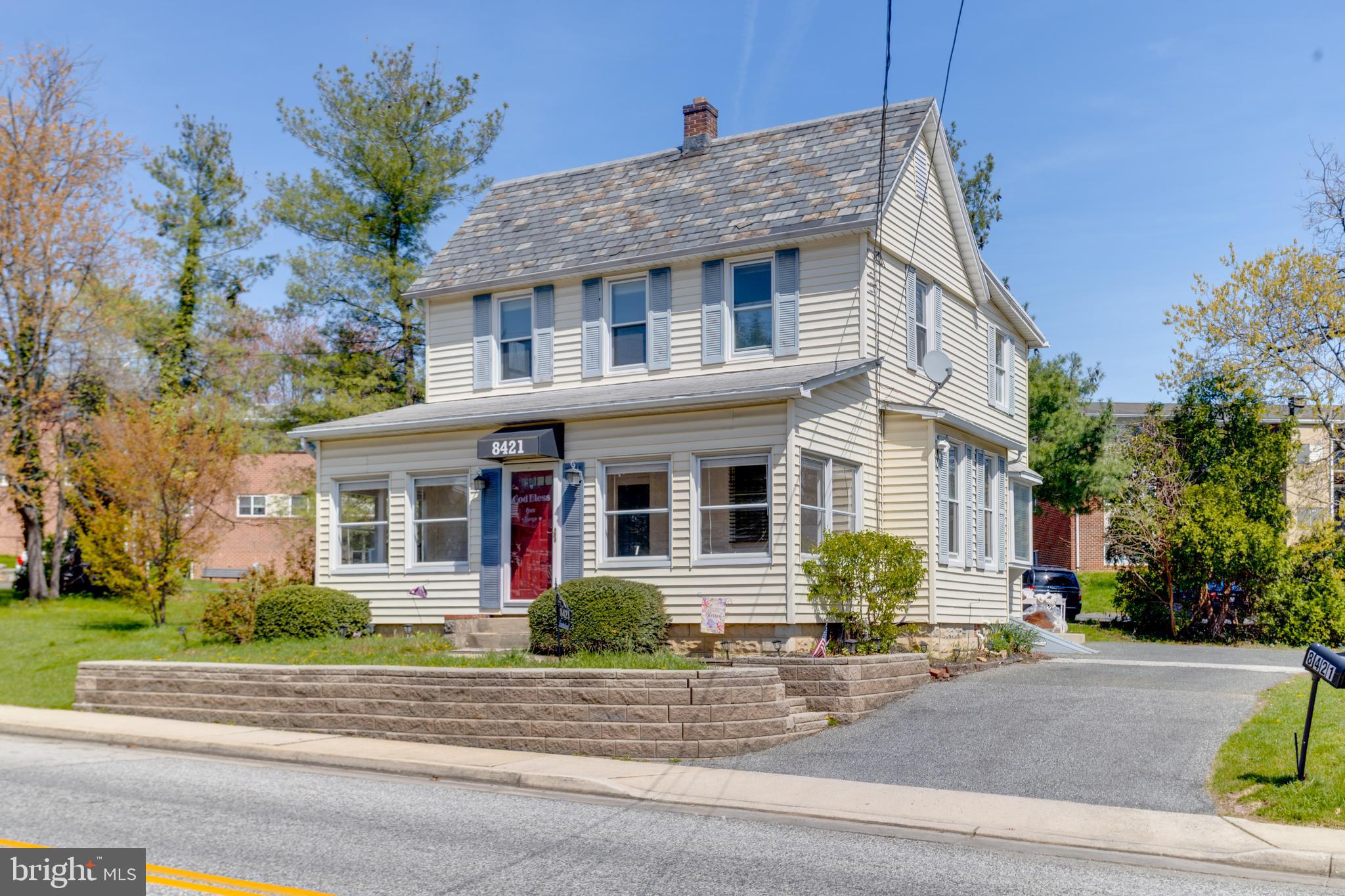 8421 Old Harford Road Parkville, MD 21234 - Photo 3 of 44 a front view of a house with a yard and garage