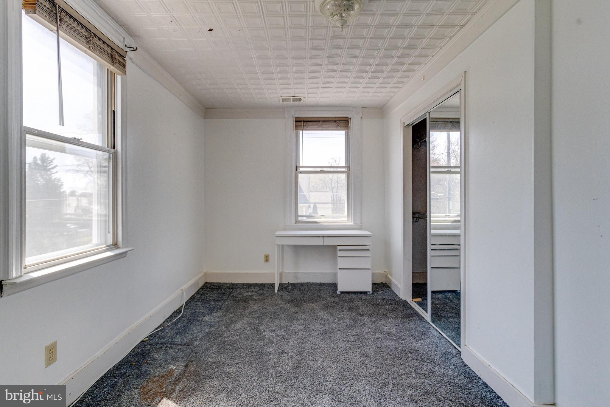 8421 Old Harford Road Parkville, MD 21234 - Photo 34 of 44 a view of empty room with windows