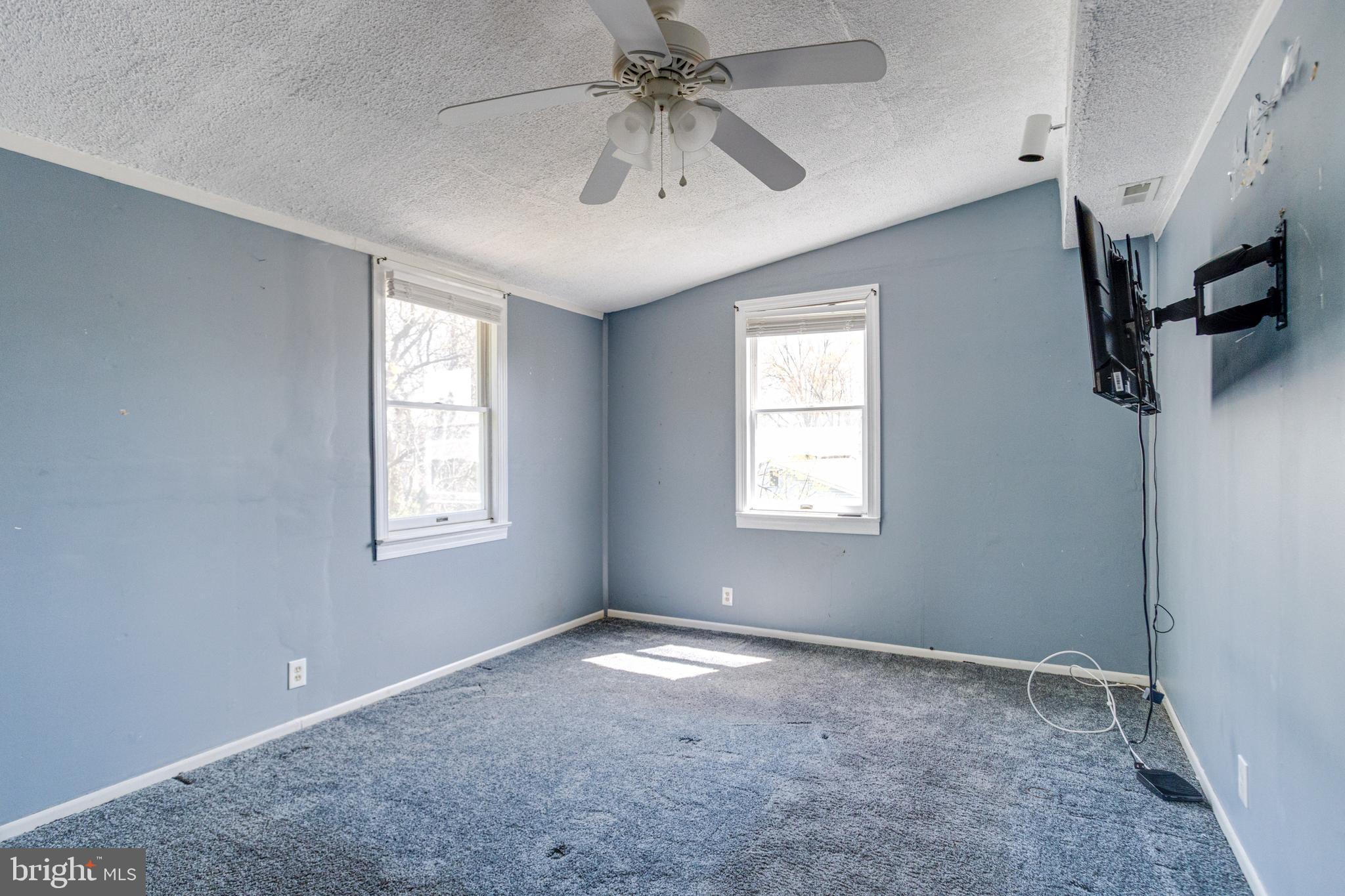 8421 Old Harford Road Parkville, MD 21234 - Photo 35 of 44 a view of a livingroom with a ceiling fan and window