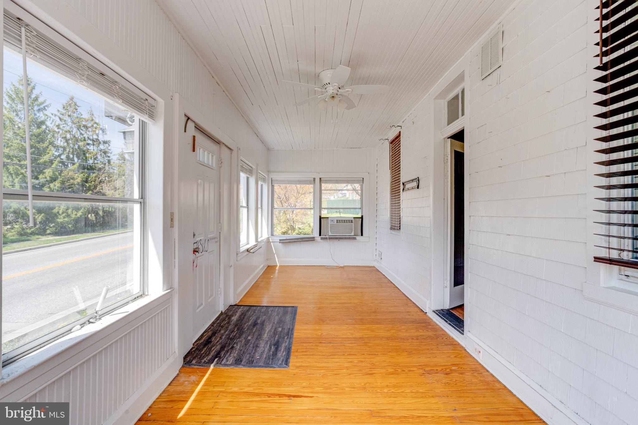8421 Old Harford Road Parkville, MD 21234 - Photo 4 of 44 a view of a living room with a large window