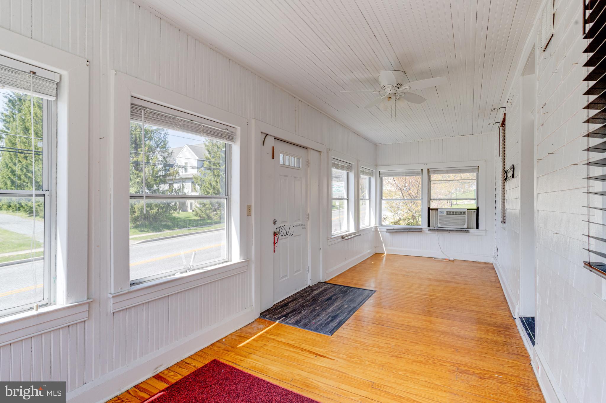 8421 Old Harford Road Parkville, MD 21234 - Photo 5 of 44 a bedroom with a bed and window