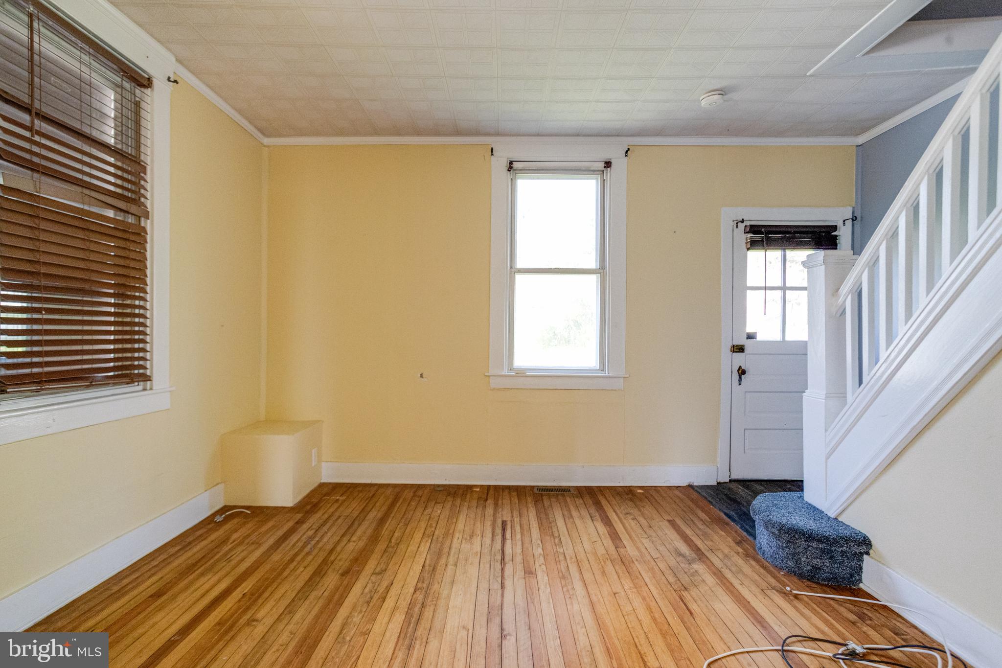 8421 Old Harford Road Parkville, MD 21234 - Photo 9 of 44 a view of a room with wooden floor and a window