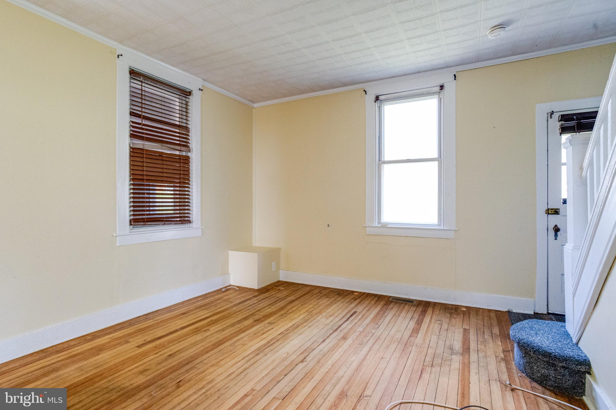 8421 Old Harford Road Parkville, MD 21234 - Photo 10 of 44 a view of a room with wooden floor and a window