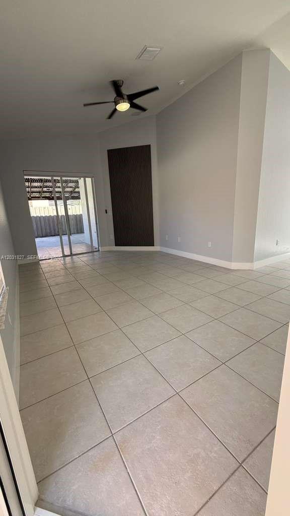 2120 Northeast 37th Road, Unit 1 Homestead, FL 33033 - Photo 13 of 30 a view of an empty room with a window