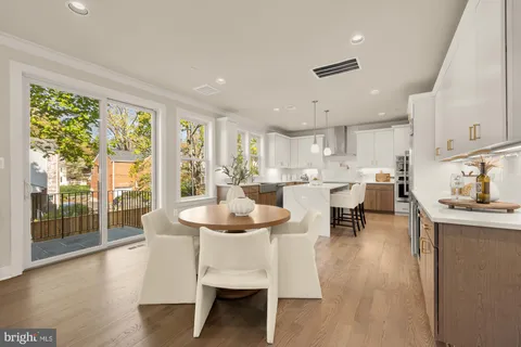 a kitchen with kitchen island granite countertop a sink appliances cabinets and a counter top space