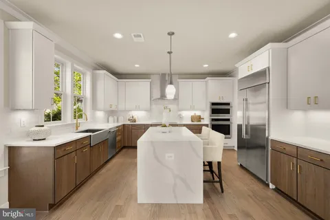 a kitchen with a sink cabinets and window