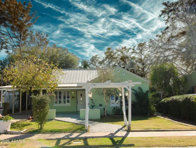 a view of a house with backyard porch and sitting area