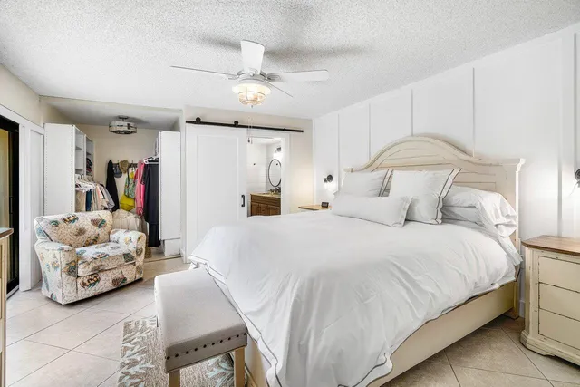 a bedroom with bed and a window