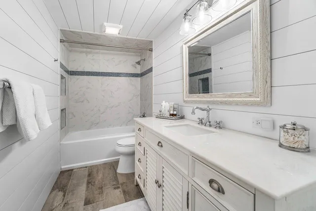 a bathroom with a sink a toilet and a bathtub
