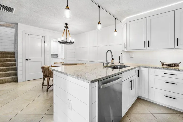 a kitchen with a sink and cabinets