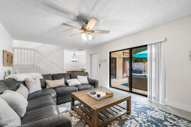 a living room with furniture a table and a window