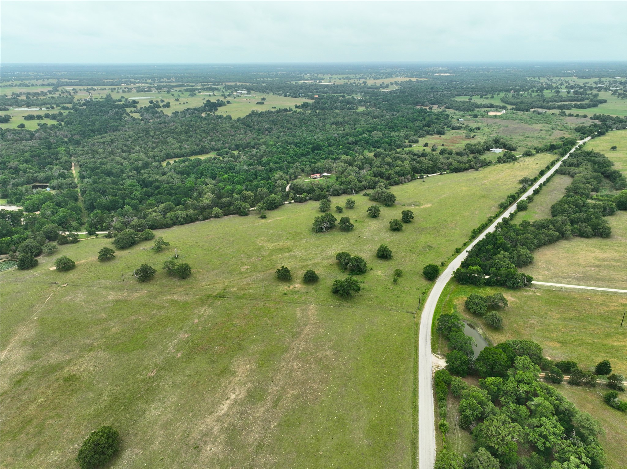 127 Cr 127 Road Ledbetter, TX 78946 - Photo 2 of 9 Aerial view of property and surrounding area featuring rural landscape