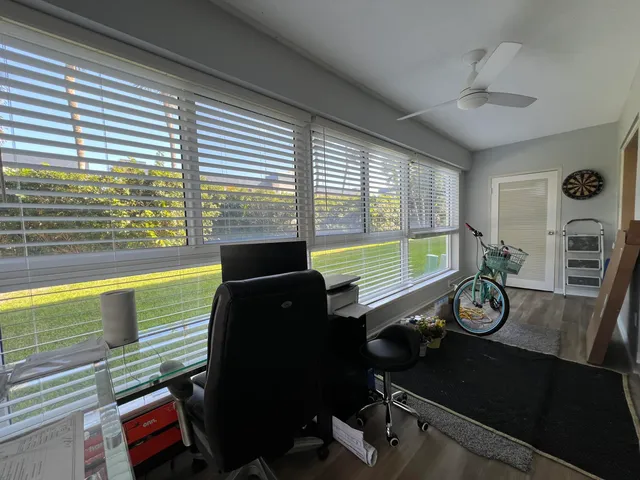 a view of a room with a large window