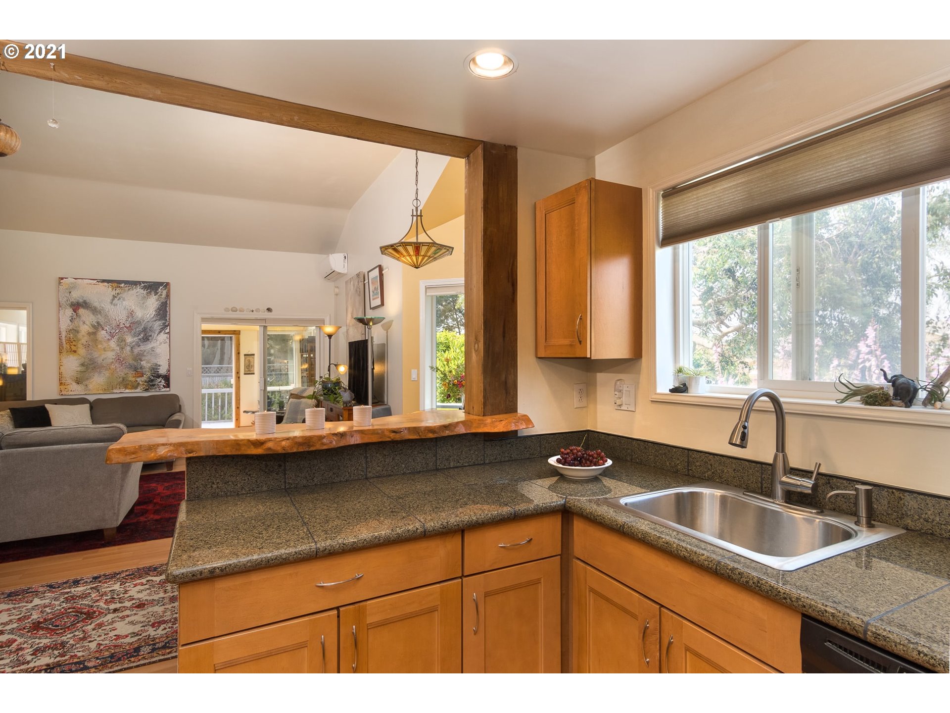 3661 Natalie Way Bandon, OR 97411 - Photo 15 of 32 a kitchen with a sink and large window