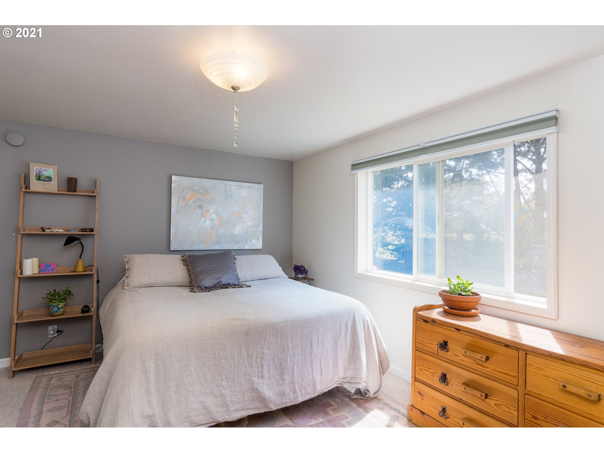3661 Natalie Way Bandon, OR 97411 - Photo 21 of 32 a bedroom with a bed and a window