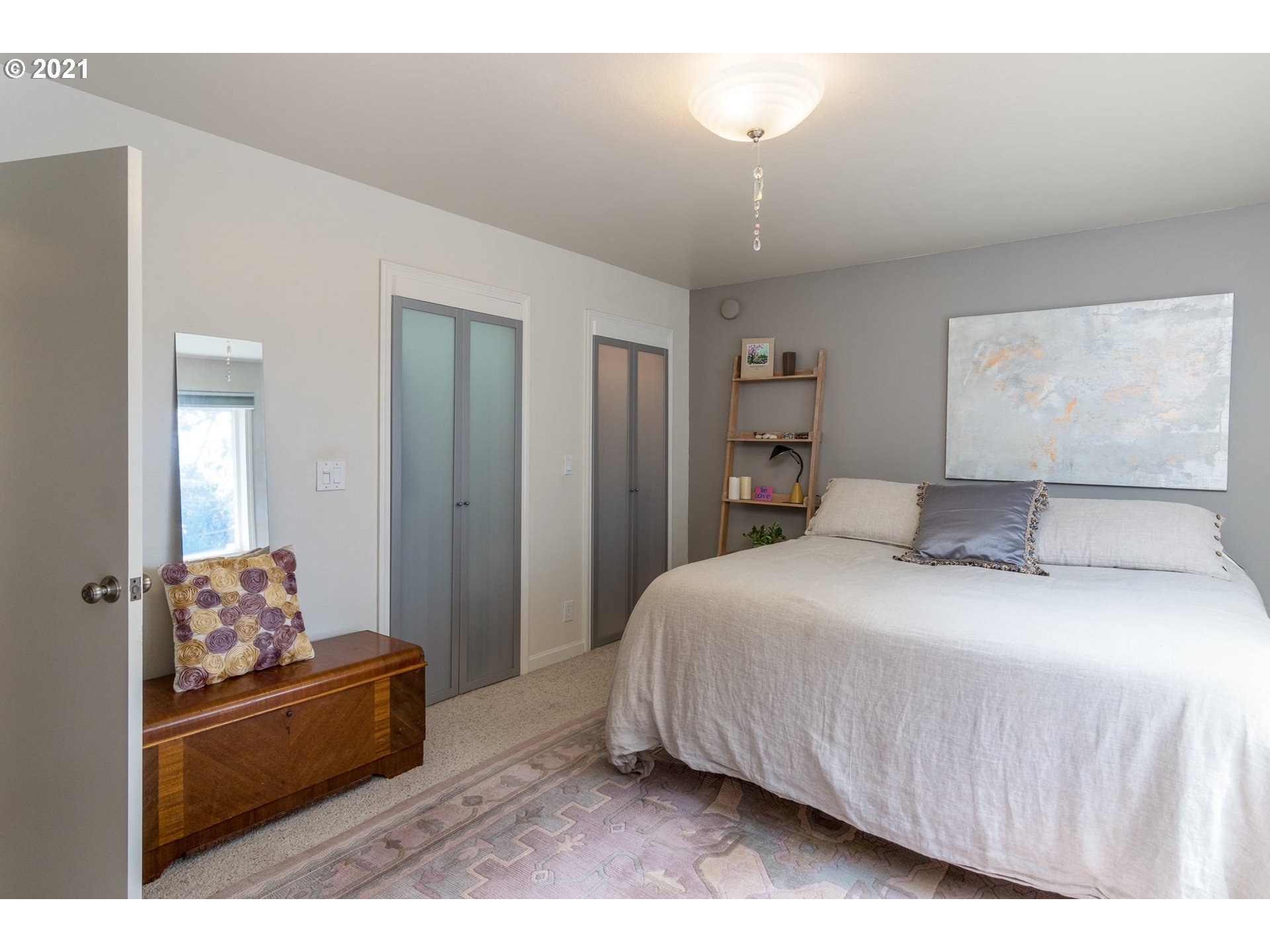 3661 Natalie Way Bandon, OR 97411 - Photo 22 of 32 a bedroom with a bed and a dresser