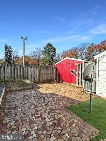 a view of a backyard with swimming pool