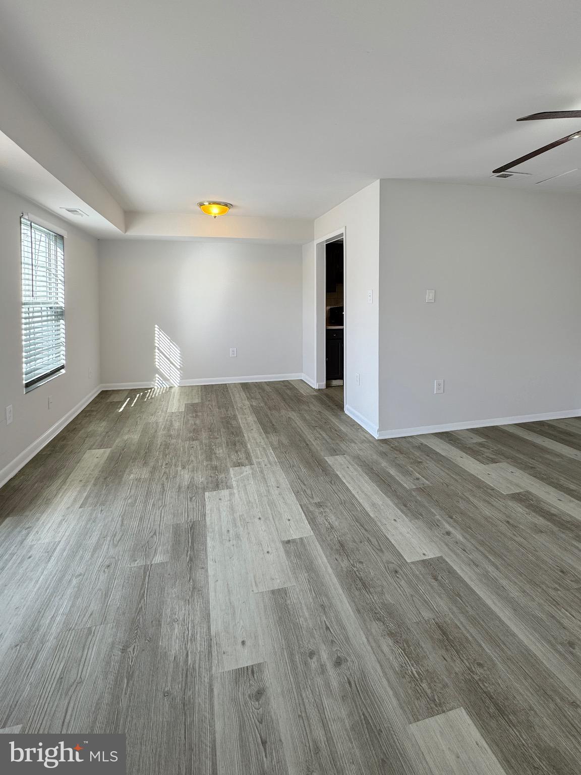 3773 Port Hope Point Triangle, VA 22172 - Photo 3 of 15 a view of empty room with wooden floor and fan