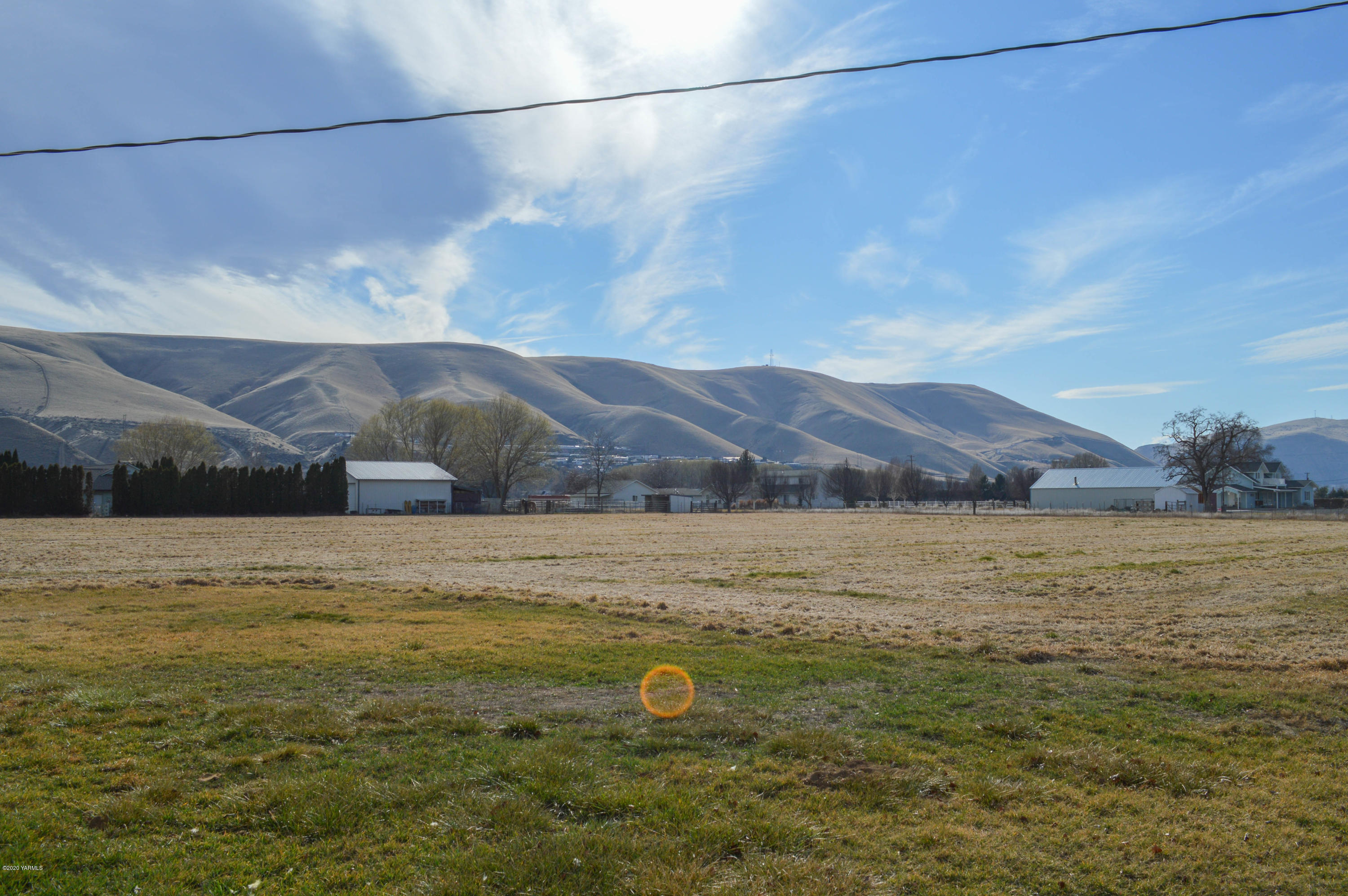 4915 Gamache Road Moxee, WA 98936 - Photo 2 of 6 a view of a lake and a mountain in the background