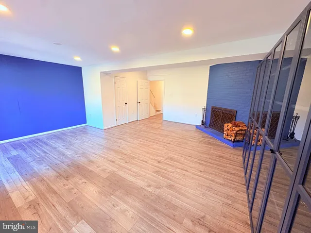 a bedroom with a bed and a mirror