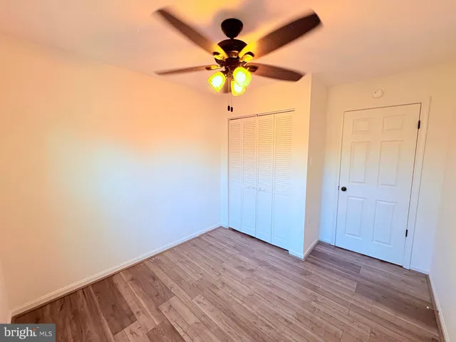 a view of a hallway with a chandelier