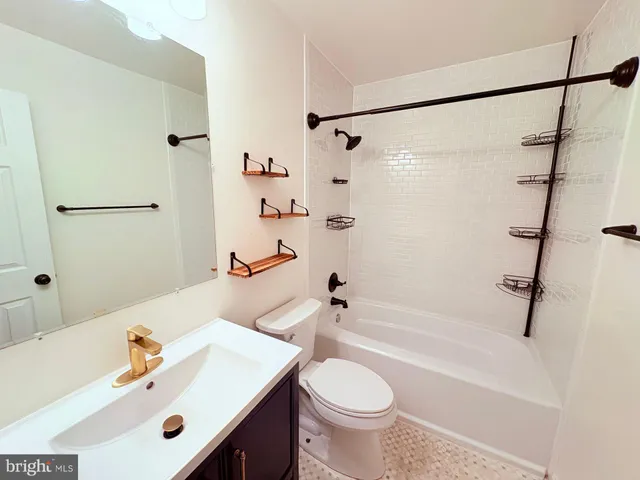 a bathroom with a sink a toilet and a bathtub