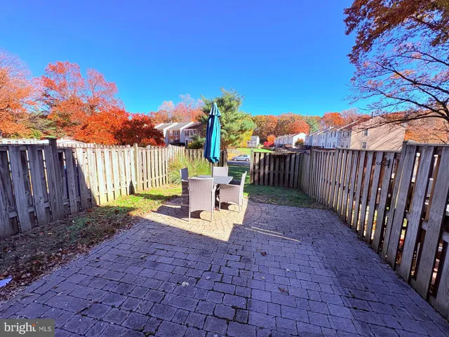 a view of a back yard with a patio