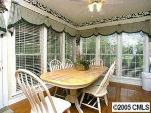 7620 Ridgefield Drive Charlotte, NC 28269 - Photo 4 of 8 a view of a chairs and table in the patio