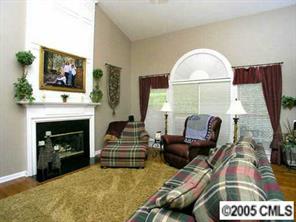 7620 Ridgefield Drive Charlotte, NC 28269 - Photo 6 of 8 a living room with furniture and a fireplace