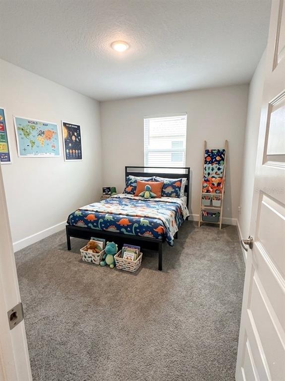 13058 Ogden Glade Road Dade City, FL 33525 - Photo 6 of 14 a bedroom with a bed and a window