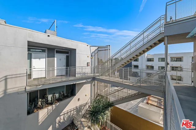 a front view of a house with large windows