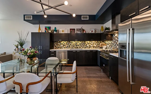 a kitchen with a table and chairs